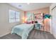 Charming bedroom with a cozy bed, desk, bookshelves, and accent lighting for a welcoming atmosphere at 6521 Cinnamon Hazelnut St # Lot 91, North Las Vegas, NV 89084