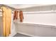 Walk-in closet offering ample storage with built-in shelving and clothing hanging from rods at 6521 Cinnamon Hazelnut St # Lot 91, North Las Vegas, NV 89084