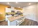 Well-appointed kitchen featuring a large island with seating and modern stainless steel appliances at 6521 Cinnamon Hazelnut St # Lot 91, North Las Vegas, NV 89084