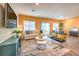 Bright living room with wood floors, neutral walls, and modern furniture at 6521 Cinnamon Hazelnut St # Lot 91, North Las Vegas, NV 89084