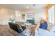 Comfortable living room featuring wood-look floors, neutral decor, and modern furnishings at 6521 Cinnamon Hazelnut St # Lot 91, North Las Vegas, NV 89084