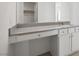 Bathroom vanity with a quartz countertop and cabinets at 6712 Violet Cascade Ave, Las Vegas, NV 89156