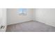 Bedroom with neutral carpet, window and closet doors at 6712 Violet Cascade Ave, Las Vegas, NV 89156