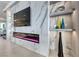 Close up of a decorative marble accent wall featuring a fireplace and built-in shelving at 677 Overlook Rim Dr, Henderson, NV 89012