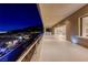 Spacious balcony with stainless steel railings offering views of the neighborhood and city lights at 677 Overlook Rim Dr, Henderson, NV 89012