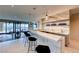 Stylish bar area with marble countertop, pendant lighting, and panoramic views, perfect for entertaining guests at 677 Overlook Rim Dr, Henderson, NV 89012