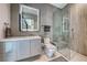 Contemporary bathroom with modern vanity, lighted mirror, and a glass-enclosed shower with built-in seating at 677 Overlook Rim Dr, Henderson, NV 89012