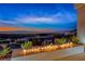Enjoy the expansive city views from the outdoor fire feature at 677 Overlook Rim Dr, Henderson, NV 89012