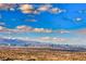 Sweeping daytime view of the city skyline and distant mountains at 677 Overlook Rim Dr, Henderson, NV 89012