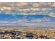 Expansive view of the city and mountain range under a cloudy sky at 677 Overlook Rim Dr, Henderson, NV 89012
