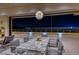 Dining area with an elegant marble table that leads to a balcony with city views at 677 Overlook Rim Dr, Henderson, NV 89012