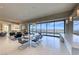 Bright dining area with modern table and floor-to-ceiling windows showcasing city views at 677 Overlook Rim Dr, Henderson, NV 89012