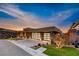Contemporary home featuring modern architecture, a three-car garage, and desert landscaping at 677 Overlook Rim Dr, Henderson, NV 89012