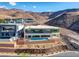Stunning multi-level home boasts a modern design, pool, and panoramic mountain views at 677 Overlook Rim Dr, Henderson, NV 89012