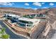 Modern home with clean lines, balcony and pool nestled in a desert landscape with rocky terrain at 677 Overlook Rim Dr, Henderson, NV 89012