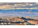 Hillside homes overlooking a vast cityscape and mountain range at 677 Overlook Rim Dr, Henderson, NV 89012
