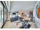 Spacious home gym featuring modern exercise equipment, tiled floors, and large windows for ample natural light at 677 Overlook Rim Dr, Henderson, NV 89012
