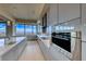 Sleek kitchen with stainless steel appliances and large windows offering stunning city views at 677 Overlook Rim Dr, Henderson, NV 89012