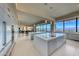 Sleek, modern kitchen with double islands, stainless appliances, and panoramic city views at 677 Overlook Rim Dr, Henderson, NV 89012