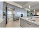 A modern kitchen featuring sleek cabinetry, stainless steel appliances, and a large island with countertop seating at 677 Overlook Rim Dr, Henderson, NV 89012