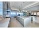 Contemporary kitchen with stainless steel appliances and mirrored backsplash at 677 Overlook Rim Dr, Henderson, NV 89012