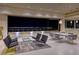 Elegant living room with an open floor plan and stunning city views at night at 677 Overlook Rim Dr, Henderson, NV 89012
