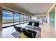 Comfortable living room with floor to ceiling windows offering breathtaking views at 677 Overlook Rim Dr, Henderson, NV 89012