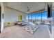 Spacious main bedroom featuring floor-to-ceiling windows with breathtaking panoramic views at 677 Overlook Rim Dr, Henderson, NV 89012