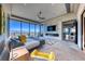 Spacious main bedroom featuring contemporary design, fireplace, and stunning city views at 677 Overlook Rim Dr, Henderson, NV 89012