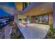 Outdoor living space featuring a fire feature, pool and incredible city views at 677 Overlook Rim Dr, Henderson, NV 89012