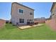 Backyard with a wood deck for outdoor grilling and a grassy lawn at 7828 Bright Lodge St, Las Vegas, NV 89139
