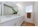 Bathroom with a double sink vanity, granite countertops, and modern fixtures at 7828 Bright Lodge St, Las Vegas, NV 89139