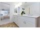 Bright bathroom with double sink vanity, white cabinets, and tile flooring at 7828 Bright Lodge St, Las Vegas, NV 89139