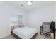 Bedroom featuring a bed, window with blinds, a desk, and a chair at 7828 Bright Lodge St, Las Vegas, NV 89139