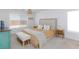 Bright bedroom features a bed, a bench, and carpet flooring at 7828 Bright Lodge St, Las Vegas, NV 89139