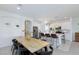 Modern kitchen and dining area with a large island, stainless steel appliances, and stylish decor at 7828 Bright Lodge St, Las Vegas, NV 89139
