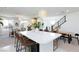 Open-concept kitchen featuring an island with seating, stainless steel appliances, and seamless integration with living spaces at 7828 Bright Lodge St, Las Vegas, NV 89139