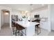 Modern kitchen featuring an island with seating, stainless steel appliances, and stylish pendant lighting at 7828 Bright Lodge St, Las Vegas, NV 89139