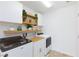 Well-organized laundry room with modern washer, dryer and shelving at 7828 Bright Lodge St, Las Vegas, NV 89139