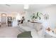 Open-concept living space showcasing a comfortable sofa, kitchen island, and modern design elements at 7828 Bright Lodge St, Las Vegas, NV 89139