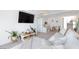 Cozy living room with a large sectional sofa, plants and stylish decor at 7828 Bright Lodge St, Las Vegas, NV 89139