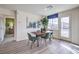 The dining room features a dark wood table and several chairs at 7935 Pandora Sky St # 381, North Las Vegas, NV 89084