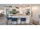 Open concept kitchen with white cabinets, stainless steel appliances, and a gray countertop with seating at 7935 Pandora Sky St # 381, North Las Vegas, NV 89084