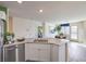 Bright, modern kitchen features stainless appliances, a large island and an inviting open floor plan at 7935 Pandora Sky St # 381, North Las Vegas, NV 89084