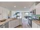 Open kitchen featuring gray countertops, stainless steel appliances, and a view into the living area at 7935 Pandora Sky St # 381, North Las Vegas, NV 89084