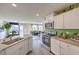 Modern kitchen featuring stainless steel appliances and views to living area at 7935 Pandora Sky St # 381, North Las Vegas, NV 89084