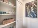 Well-organized pantry featuring open shelving and stylish storage baskets at 7935 Pandora Sky St # 381, North Las Vegas, NV 89084