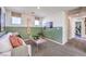 Cozy bonus room with comfortable seating, modern decor, and natural light from multiple windows at 795 Calm Crystal Ct # Lot 141, North Las Vegas, NV 89081