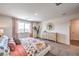 Bright and airy main bedroom featuring plush carpeting, a dresser, and a window with neighborhood views at 795 Calm Crystal Ct # Lot 141, North Las Vegas, NV 89081