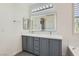 Modern bathroom featuring double sinks, a soaking tub, walk in shower and stylish tile at 8040 Arcadian Ln, Las Vegas, NV 89147
